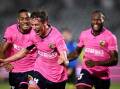 Jacob Farrell (c) celebrates after scoring the Mariners' opening goal against Adelaide United. (Dan Himbrechts/AAP PHOTOS)