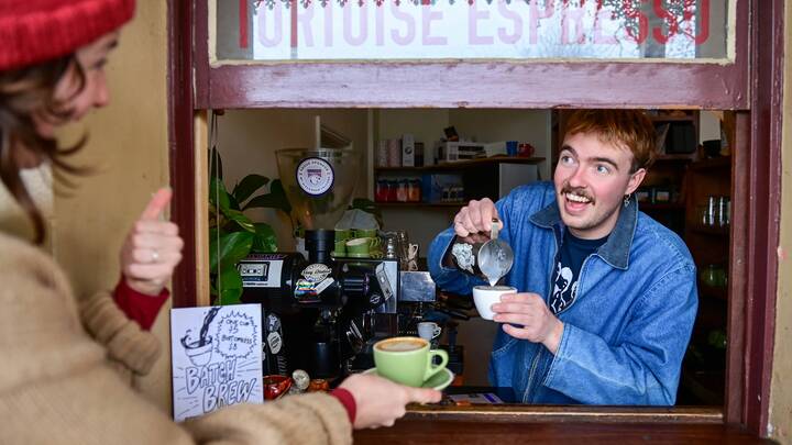 Lloyd Meadows, 20, in his Tortoise Espresso coffee window in Castlemaine, Victoria. Picture by Brendan McCarthy