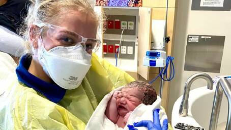 QUICK DELIVERY: Paramedic Abbie Bartley with baby Nakoah who was basically born at the side of the road. Picture: NSW Ambulance