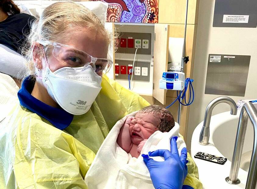 QUICK DELIVERY: Paramedic Abbie Bartley with baby Nakoah who was basically born at the side of the road. Picture: NSW Ambulance