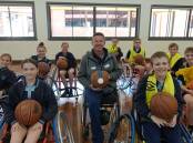 Australian Paralympian wheelchair tennis player and silver-medallist David Johnson with primary school students from the Northern Rivers