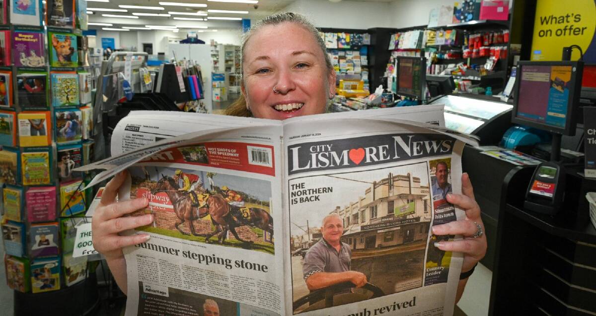 Rowena Nelson from Lismore Central Chempro Chemist and Newspro Newsagency reads the Lismore City News. Picture by Cathy Adams