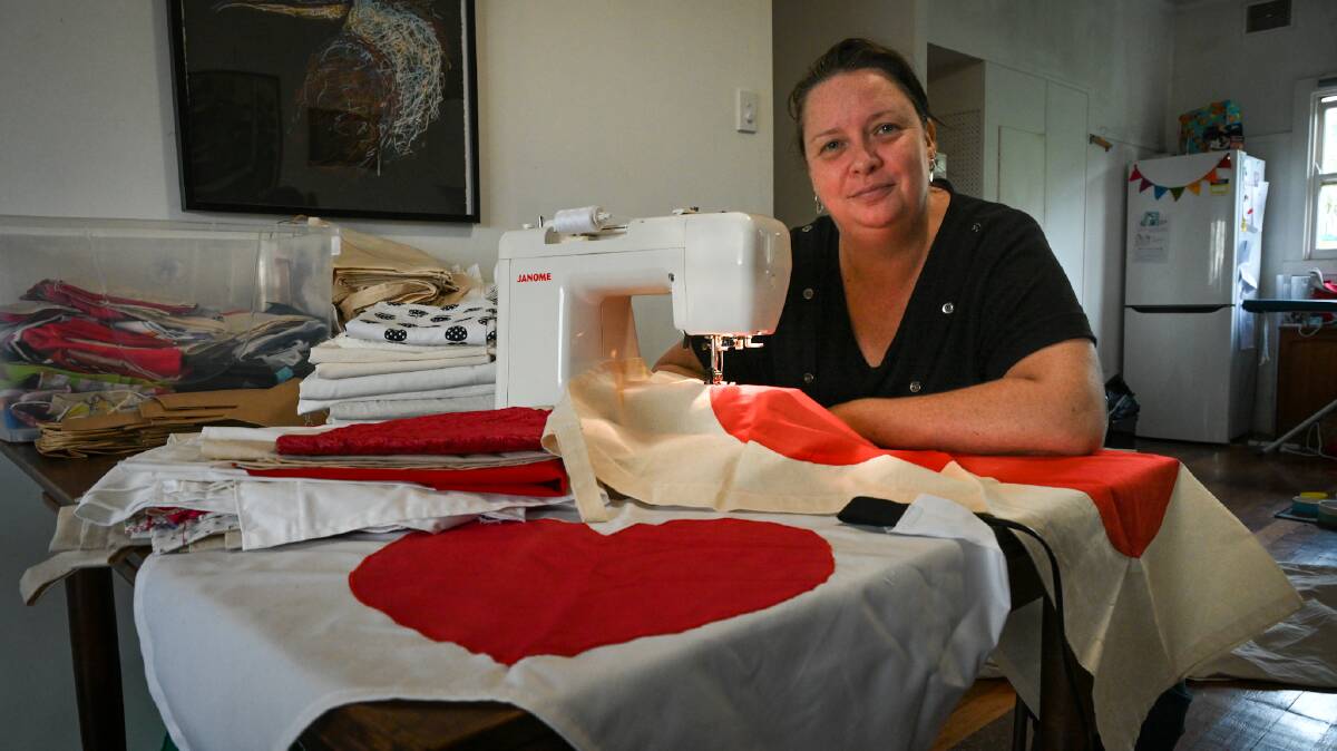 FROM THE HEART: Rebecca Ryan of Lismore Heights started sewing heart banners to help boost morale after the floods, and so Love Lismore (and surrounds) Heart banners was born. Picture: Cathy Adams