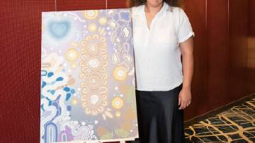 Lismore artist Tywana Caldwell with artwork Reconcile Connection. Picture supplied