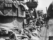 Troops bunked down on the top deck of the destroyer HMAS Vendetta on one of its 39 voyages to Tobruk. Picture: Australian War Memorial