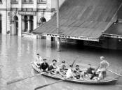 HIGH STREET: Flood affected residents at the east end of High Street, Maitland during the 1955 flood.