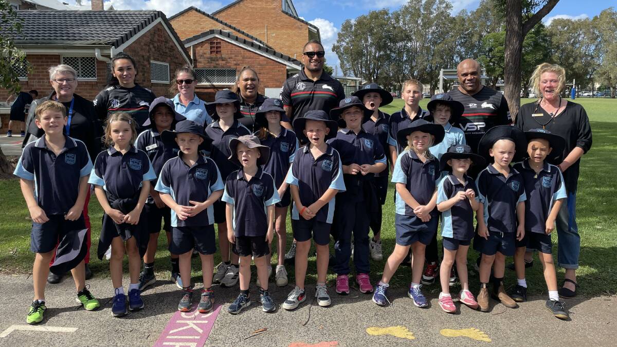 Members of the Souths Cares group with students and teachers from Wardell Public School. Picture by Mitchell Craig.