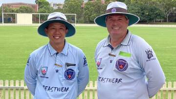 LEARNING CURVE: FAR North Coast cricket umpire Chen Tay with Rod Porter in Sydney.
