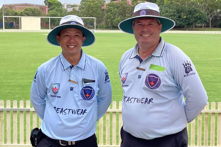 LEARNING CURVE: FAR North Coast cricket umpire Chen Tay with Rod Porter in Sydney.