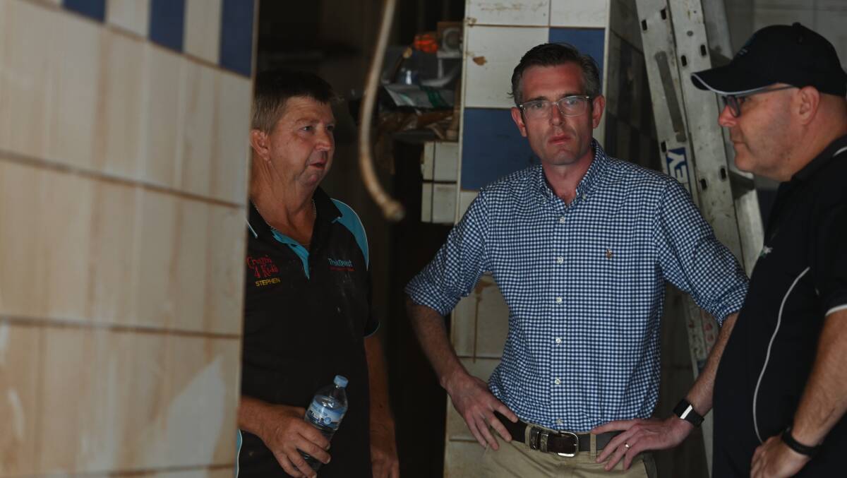 TOUGH SLOG: Southside Hot Bread owner Stephen Butcher speaking with NSW premier Dominic Perrottet and Lismore mayor Steve Krieg after the first flood. The bakery is set to reopen on Monday.Picture: Cathy Adams