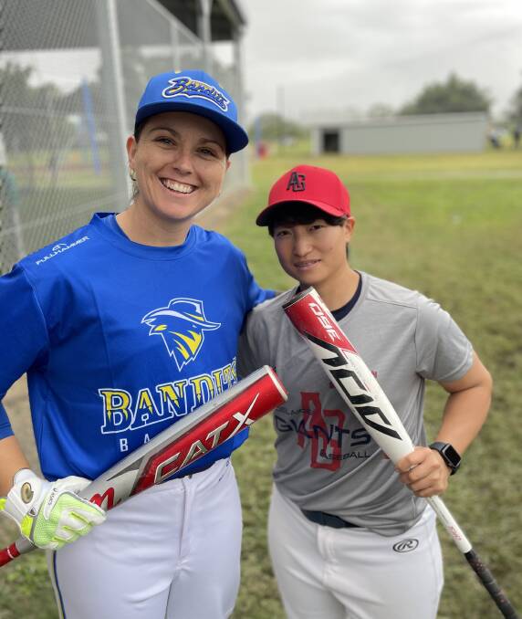 Australian Emeralds World Cup player Elodie O'Sullivan and Japanese import Sayaka Mori at the women's baseball showcase being held at Albert Park. Picture by Mitchell Craig.