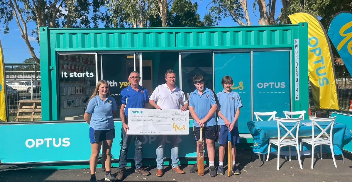 BIG BOOST: Chris Simon from Optus presents Lismore District Cricket Association president Craig Hamshaw with a $25,000 cheque for next season.
