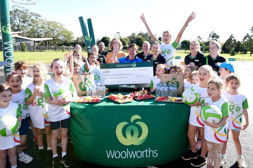 ALL SMILES: Former Australian international Cath Cox joined the Woolworths team to present Lismore Netball Association with a $30,000 financial boost. Picture: Matt Roberts