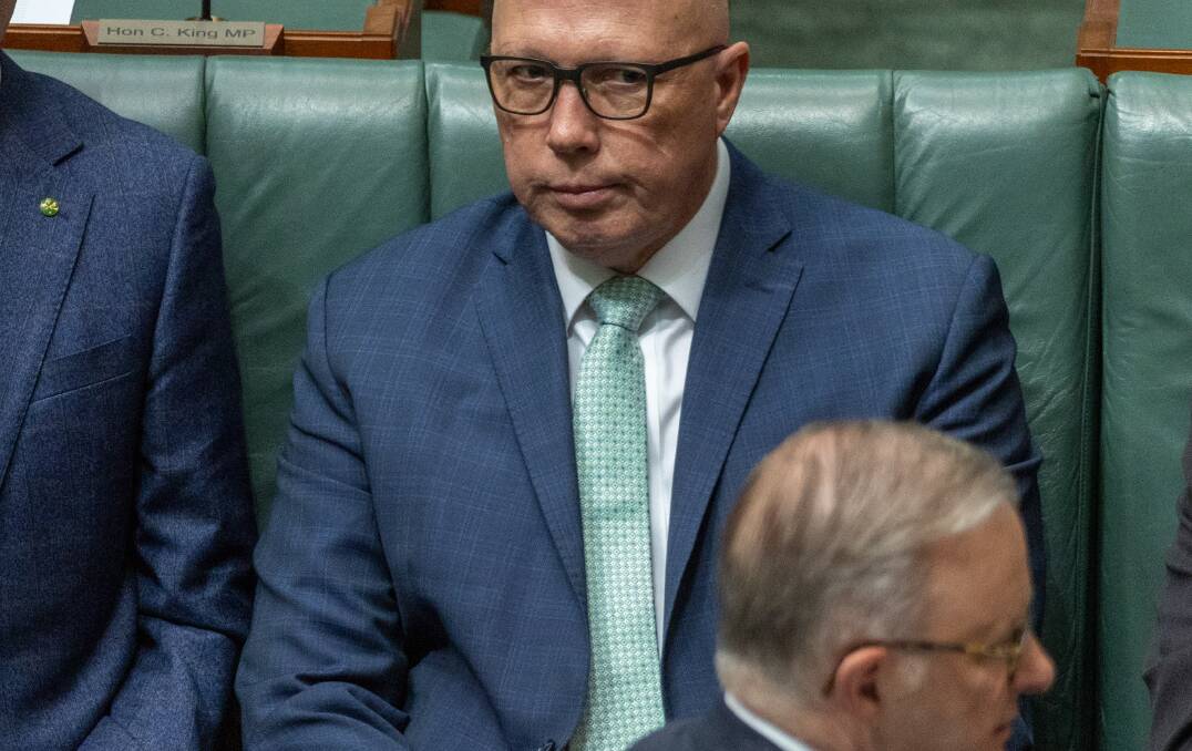 Opposition Leader Peter Dutton with his eye on Prime Minister Anthony Albanese's chair during a division. Picture by Gary Ramage