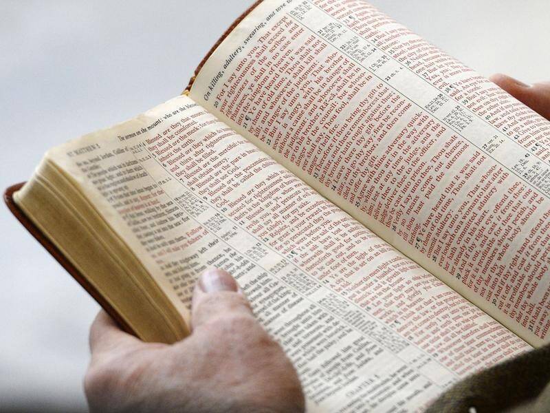 A parent unhappy about conservative-led book banning in US schools made a complaint about the bible. (AP PHOTO)