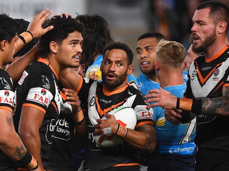 A broken jaw sidelined Api Koroisau (centre) in Wests Tigers' NRL loss to Gold Coast. (Jono Searle/AAP PHOTOS)