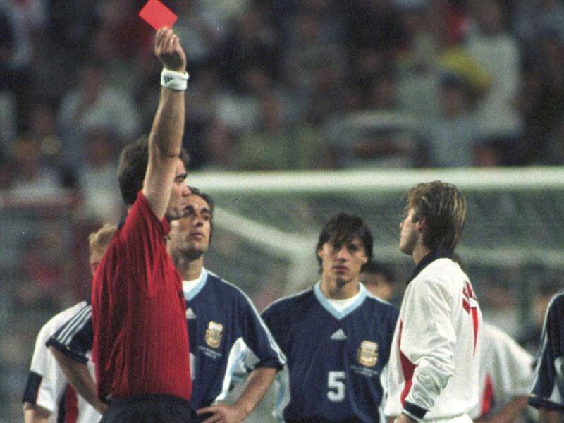 David Beckham receives a red card during England's World Cup match against Argentina in 1998. (AP PHOTO)