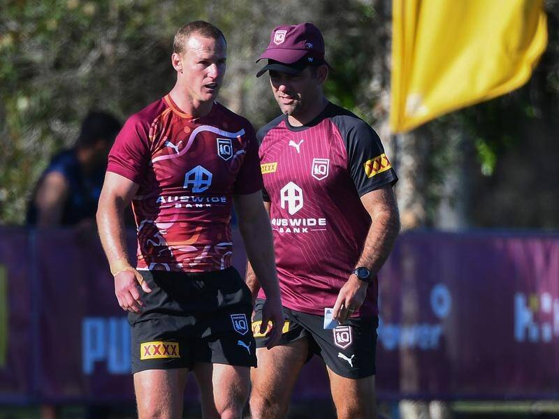 Daly Cherry-Evans (l) and Maroons assistant Cameron Smith (r) prepare for Origin II against NSW. (Jono Searle/AAP PHOTOS)