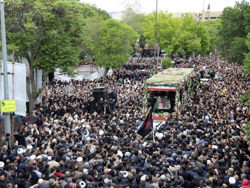 Thousands gathered around a truck carrying the coffin of President Ebrahim Raisi. (AP PHOTO)