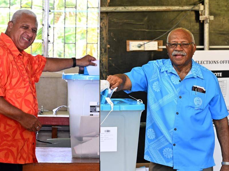 Prime Minister Frank Bainimarama and Sitiveni Rabuka are awaiting the outcome of Fiji's election. (Mick Tsikas/AAP PHOTOS)