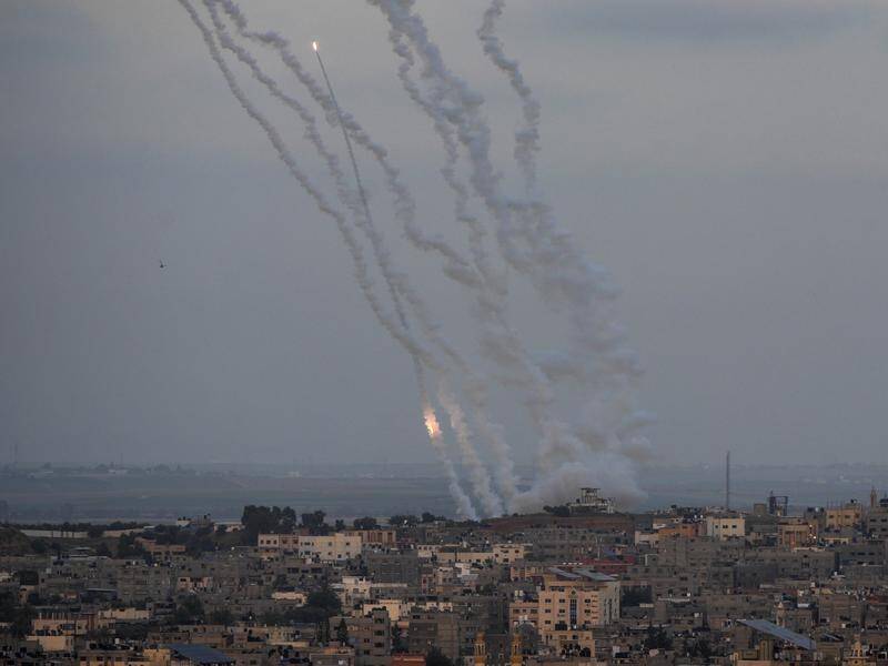 Palestine launches rockets from the Gaza Strip towards Israel, hours before a ceasefire is agreed. (AP PHOTO)