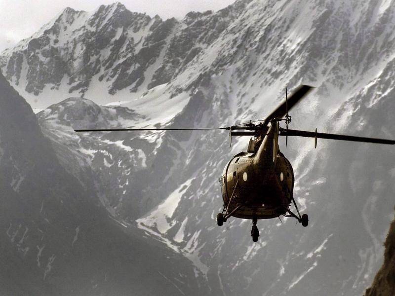 Two military helicopters helped retrieve bodies and rescue survivors of a Pakistan avalanche. (EPA PHOTO)