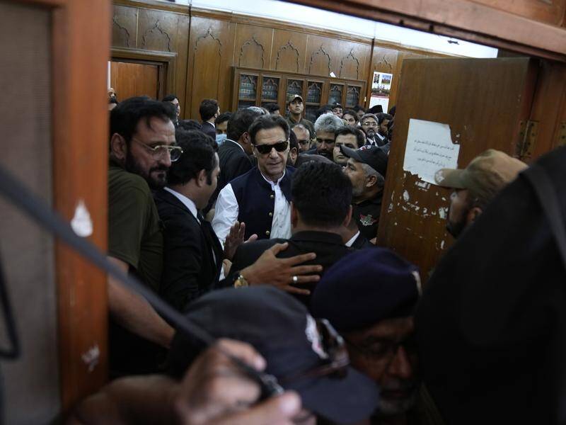 Pakistan's former PM Imran Khan leaves court after being granted bail on murder charges. (AP)