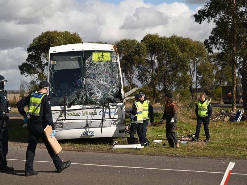 A truck driver is on bail after 18 children were taken to various hospitals following a bus crash. (Joel Carrett/AAP PHOTOS)