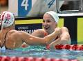 Mollie O'Callaghan (right) is congratulated by Shayna Jack after winning the 200m freestyle final. (Dave Hunt/AAP PHOTOS)