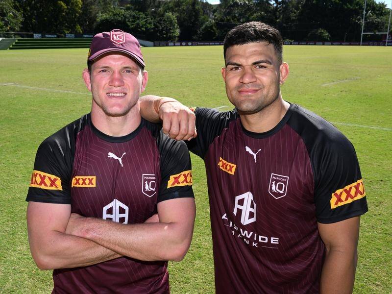 Tom Gilbert (l) and David Fifita (r) have gone from fierce junior rivals to Maroons teammates. (Darren England/AAP PHOTOS)